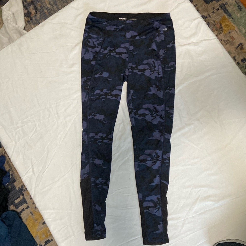 Blue camouflage leggings with sheer black inserts at calves. Size small. GUC